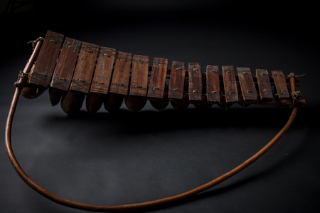 African music instrument, wooden marimba with two bakets, isolated on dark backgroundの写真素材