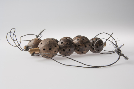 African handmade instrument, rattle isolated on white backgroundの写真素材