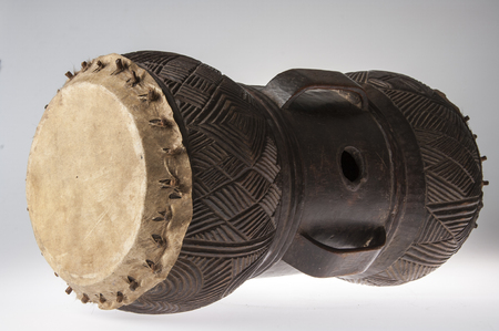 African music instrument, drum made of wood, isolated on white backgroundの写真素材