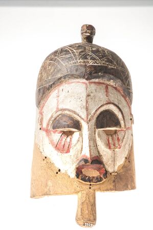 African wooden mask isolated on white backgroundの写真素材