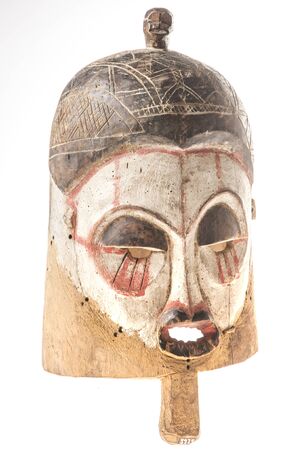 African wooden mask isolated on white backgroundの写真素材