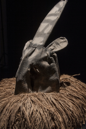 African mask with cloth hair isolated on black background, ciandaの写真素材