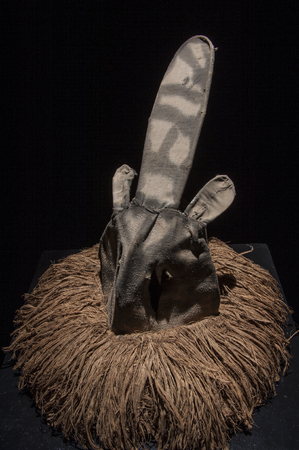 African mask with cloth hair isolated on black background, ciandaの写真素材