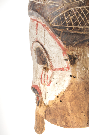 African wooden mask isolated on white backgroundの写真素材