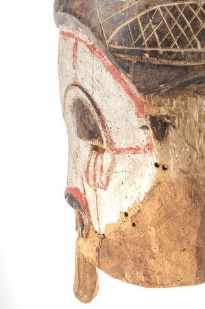 African wooden mask isolated on white backgroundの写真素材
