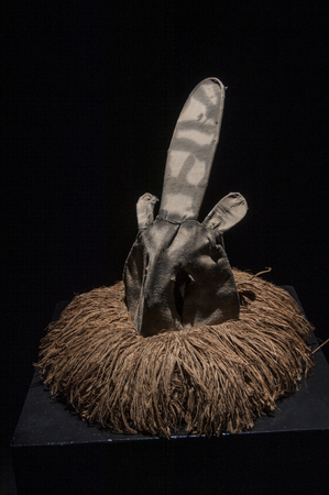 African mask with cloth hair isolated on black background, ciandaの写真素材