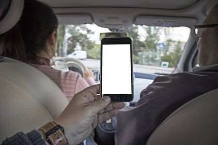 Mobile phone with GPS to give the girl directions to driveの写真素材