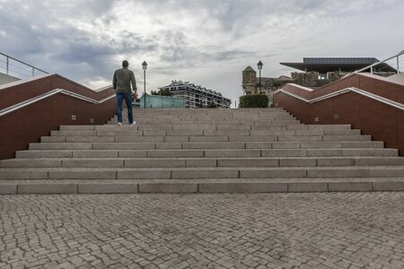 Man climbing stairsの写真素材