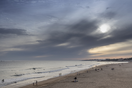 Sunset on surfers beach in carcavelos, portugalの写真素材