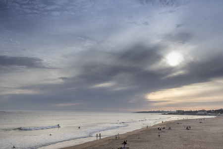 Sunset on surfers beach in carcavelos, portugalの写真素材