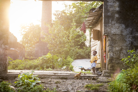 MALANZA/SAO TOME - 2 JAN 2016 - Small child at the door house in sÃ£o tomÃ©のeditorial素材