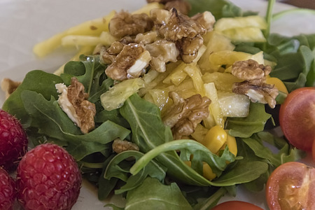 Entrance of salad with walnuts, rucula, pineappleの写真素材
