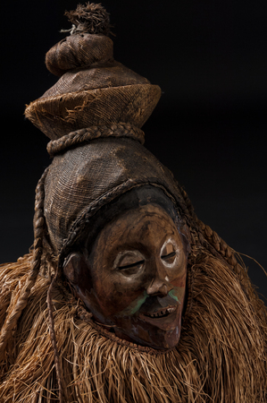 African wooden masks. With hair. Isolated on black background.の写真素材