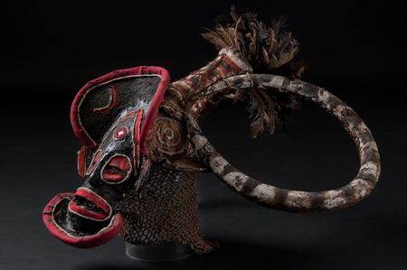 African mask of cloth, traditional, isolated on black background.の写真素材