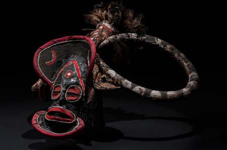 African mask of cloth, traditional, isolated on black background.の写真素材