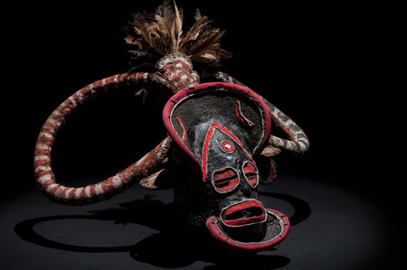 African mask of cloth, traditional, isolated on black background.の写真素材