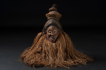 African wooden masks. With hair. Isolated on black background.の写真素材