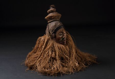 African wooden masks. With hair. Isolated on black background.の写真素材