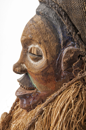 African wooden masks. With hair. Isolated on white background.の写真素材
