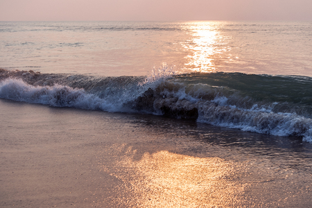 Waves in the sea with sunset.の写真素材