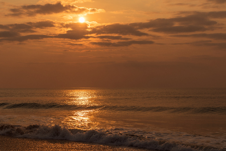 Waves in the sea with sunset.の写真素材