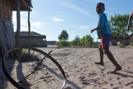 DUNDO/ANGOLA - 23 APRIL 2015 - African rural child with his traditional toy.のeditorial素材