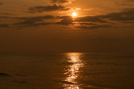 Waves in the sea with sunset.の写真素材