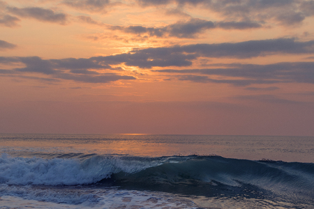 Beautiful sunset at cabo ledo beach Angola. With waves. Dramatic sky.の写真素材