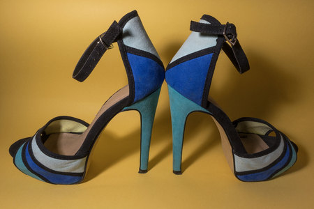 Woman shoes on yellow backgroundの写真素材