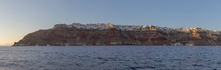panoramic view of Oia, Greece Santorini, view from the sea with sunset.の写真素材