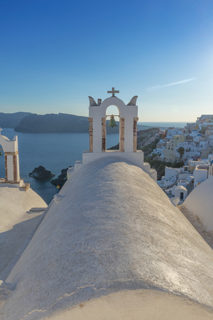 Church bell in oia, Santorini. Sunset. Greece.の写真素材