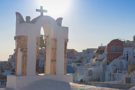 Church bell in oia, Santorini. Sunset. Greece.