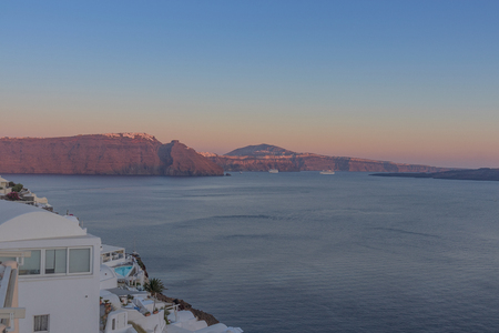 Beautiful sunset in Oia Santorini with caldera view. Greece,の写真素材