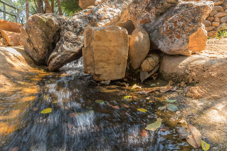 Fluent in water with stones.の写真素材