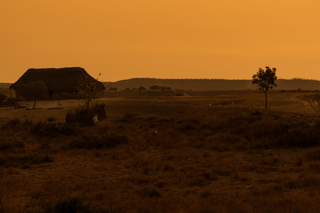 African village with sunset. Angola.の写真素材
