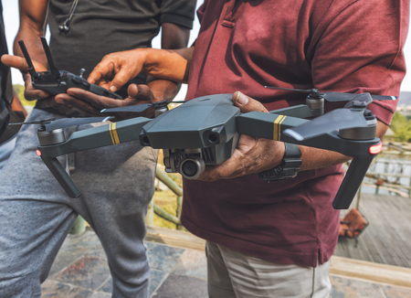 Man to program drone before taking off.の写真素材