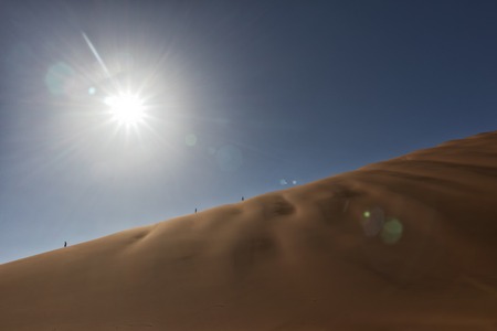 People climbing dune, Namibia. Sossusvlei.の写真素材