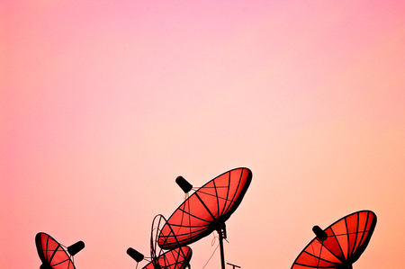 Television antennas with sunset.の写真素材