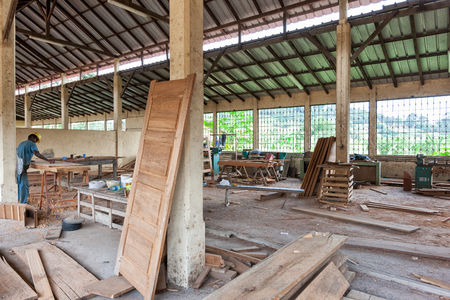 CABINDA/ANGOLA - 08JUN2010 - carpentry factory with African operatorsのeditorial素材