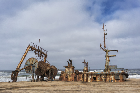 Ship wrecked and buried and abandoned on the coast of the Namibe Desert. Africa, Angola.の写真素材