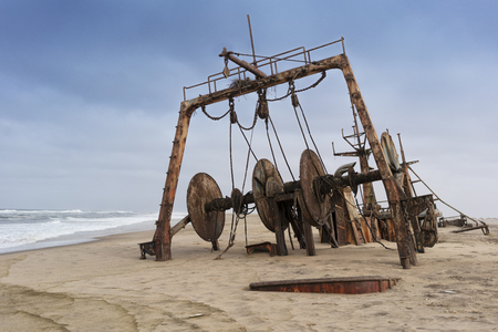 Ship wrecked and buried and abandoned on the coast of the Namibe Desert. Africa, Angola.の写真素材