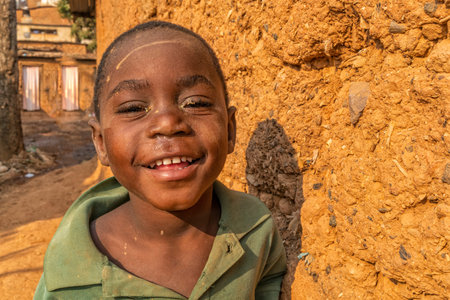 NDALATANDO/ANGOLA - 27 JUL 2017 - Portrait of African Boy in the alleys of rural village.のeditorial素材
