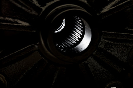 Extreme close up of car bumper pulley.