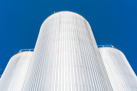 Beverage factory cylinders. With blue sky.