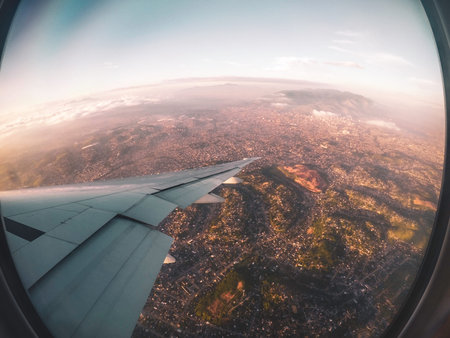 Aerial view of the Brazilian city of Rio de Janeiro, with window and airplane wing.