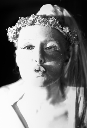 LUANDA/ANGOLA 10 NOV 2014 - Greek masked woman pretending to kiss.のeditorial素材