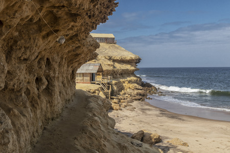 Coast of the Namibe Desert with canyons and wooden houses Angola. Africa.の写真素材