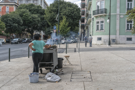 LISBON/PORTUGAL 21OCT2018 - Vendor of chestnuts in the streets of Lisbon. Portugalのeditorial素材