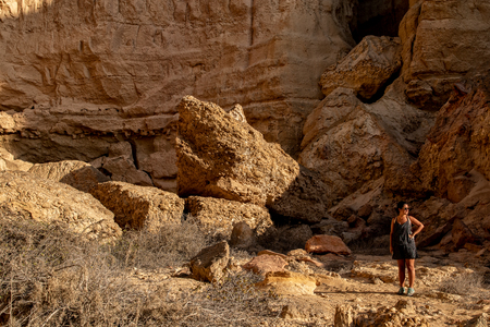 NAMIBE/ANGOLA - 03NOV2018 - Young girl in the middle of the canyons of the Namibe Desert. Africa. Angola.のeditorial素材