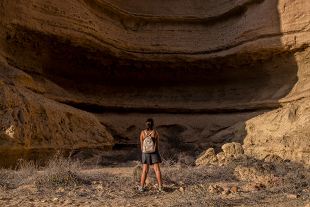 Young girl in the middle of the canyons of the Namibe Desert. Africa. Angola.の写真素材